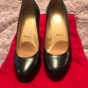 Pair of black Christian Louboutin platform pumps
